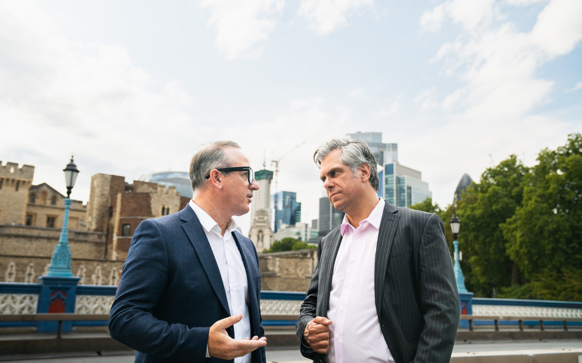 Two members of the Wilton team in conversation on Tower Bridge, London